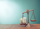 Law scales and cash money on table concept photo